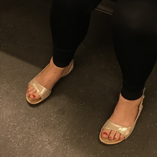 cute red toes in golden flat sandals