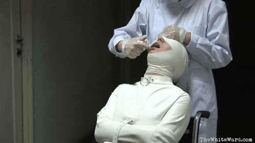 Open Wide! Patient 002 Is Being Prepared For Her Electroshock Therapy. Gag Is Inserted Into Patient’s