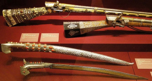 Turkish miquelet rifles and swords, 19th century.