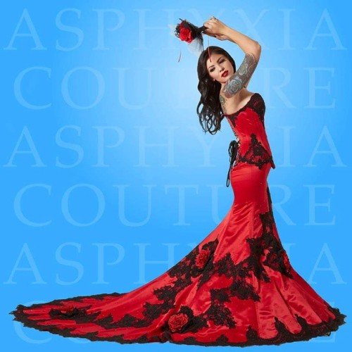 Red delustered satin and black alencon lace bridal corsetted gown. For all orders & enquiries, p