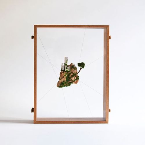 archatlas:  Miniature Houses on Cork Cliffs Float Inside Handmade Wooden Frames by Rosa de Jong  Designer Rosa de Jong produces micro homes that are built into the side of tiny cliffs constructed out of cork. Her miniature environments are covered in