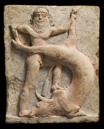 archaicwonder:Gilgamesh Kills The Bull of HeavenThis is a Neo-Sumerian terracotta votive relief (c. 