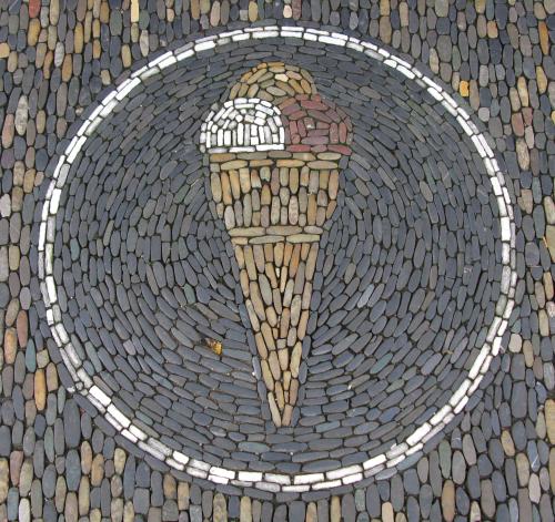 (via Cobblestone mosaic of an ice cream cone, marking a dessert eatery in Freiburg im Breisgau, Germ