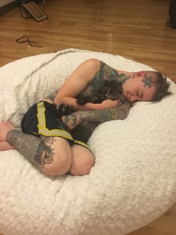 reaperskeeper:  tobiasxva:  skin-rivets-tyler:  Kali and I just wanna sleep and cuddle  Lovesac!  I cant handle this. Look at that little kitty face. ☺️ 