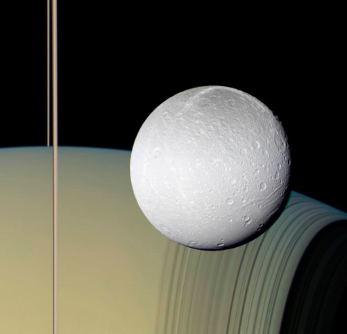 crimsonkismet:an actual true color photograph showing Saturn, its rings, and one of its moons taken 