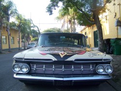 opalescentluminescent:  I believe this is about a 1960-ish Chevy Impala, but with a cool Sailor Jerry tattoo art paintjob, seen in the Bywater neighborhood of New Orleans. 