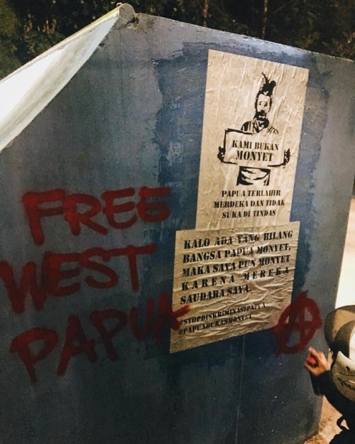 Anarchist graffiti and posters in solidarity with the West Papuan liberation struggle seen in Tanger