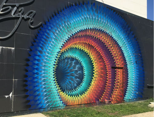 hifructosemag:  Miami’s Douglas Hoekzema, also known as Hoxxoh, creates murals that do more than absorb the gaze of the viewer. Nearby objects appear as though they can be pulled into the artist’s latest, hyperdimensional works. More on HiFructose.com.