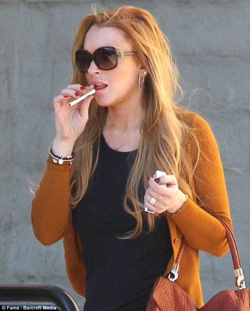 paintdeath:A photoset of Lindsay Lohan smoking. Thank me for it later