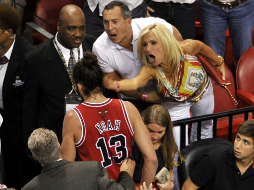 usatodaysports: The most intense NBA photo ever. At Heat-Bulls Game 2, a fan gives Joakim Noah the f