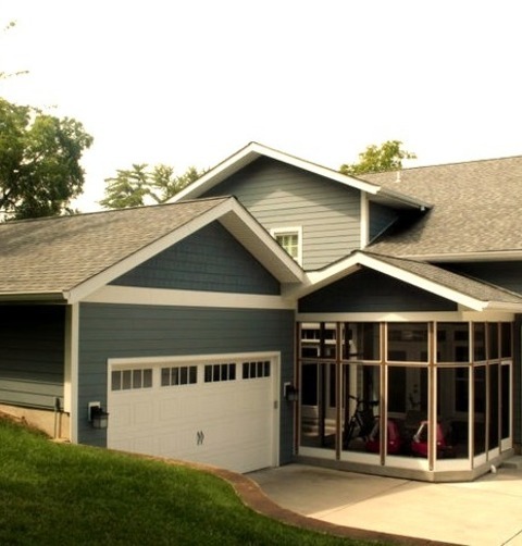 Traditional Exterior In St LouisExample Of A Large Classic Blue Two-story Concrete Fiberboard Exterior