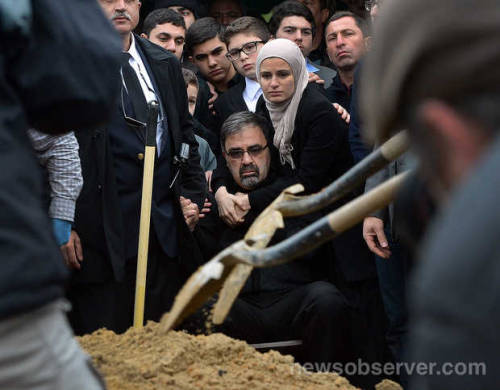 coffeeandfaith:Namee Barakat (center, bottom) watches as his son Deah Shaddy Barakat is buried Thurs