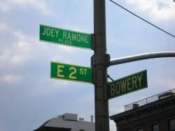 Nov 30 2003 - A block of East 2nd Street in New York City was officially renamed Joey Ramone Place. It is the block where Joey once lived with band mate Dee Dee Ramone, and is near the music club CBGB, where the Ramones played their first gigs. In 2010,