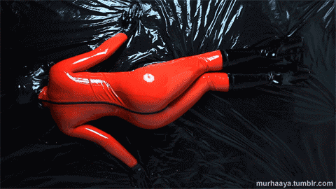 murhaaya:  Red catsuit on latex bed 2/2  blackbox96@tumblr.com a kinky collection of rare, carefully
