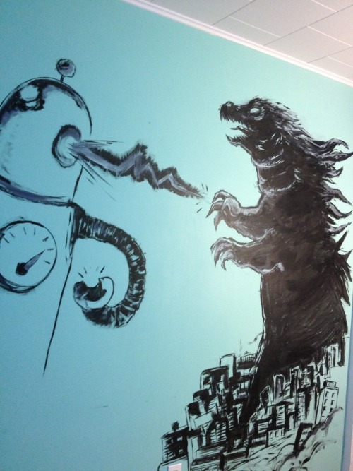 Godzilla battling some robot on my living room wall. (unfinished)