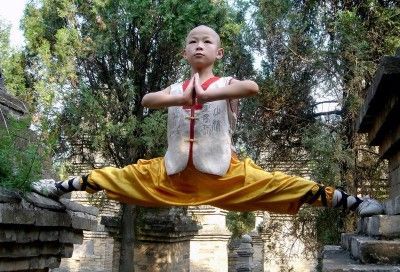 taichi-kungfu-show:  Young kid practicing Shaolin kung fu.    We offer you first-rate tai chi swords on: http://www.icnbuys.com/tai-chi-swords    