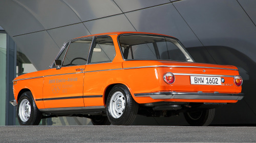 What a difference 50 years makes juxtaposition of BMW 1602 Elektroantrieb, 1972 & BMW i4, 2022. 