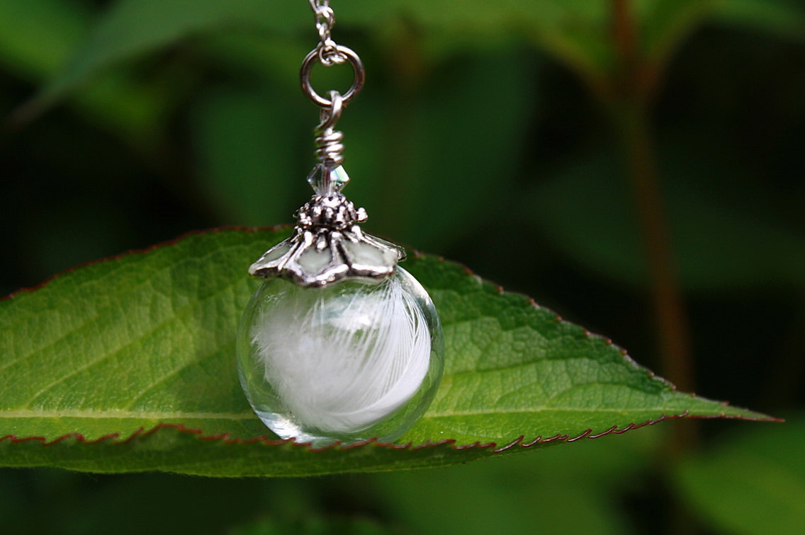wickedclothes:  White Feather Glass Bubble Glow In The Dark Necklace Inside of this