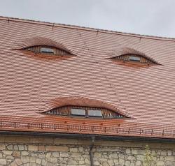 evilbuildingsblog:  Creepy ass face looking windows in this roof…