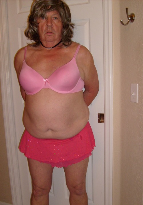 sissytormentor: sissyneedsorders:Sissy Tina Tinyclitty poses in a pink bra and tiny skirt.  She is s