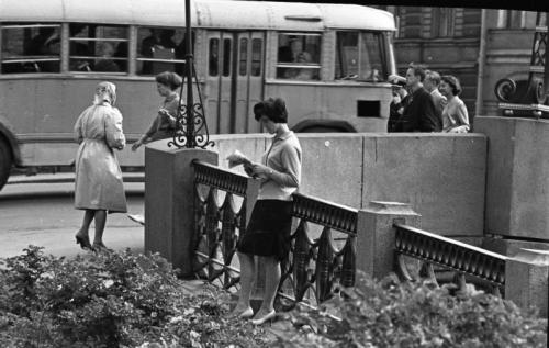 A woman reading by the canal. Photo by Vsevolod Tarasevich (Leningrad, 1960s).