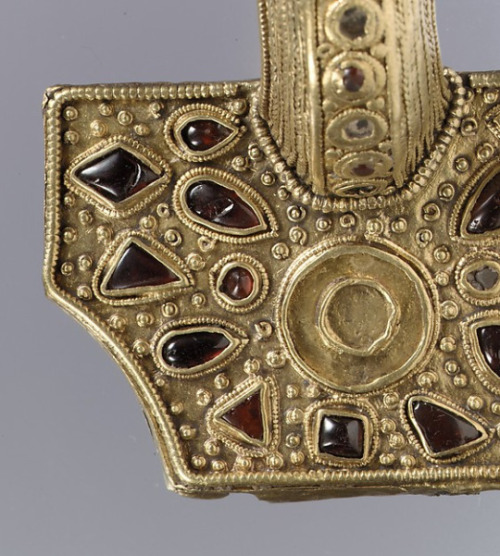 Bow brooch (detail)East Germanic, 400–450 AD Silver with gold-sheet overlay and garnetsEastern