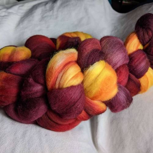 a braid of fibre that goes from deep maroon to gold