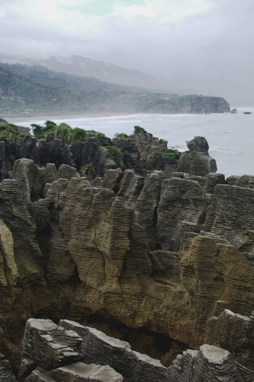 photographybywiebke:Grey clouds and rough seas at the Pancake Rocks in Punakaiki, New Zealand