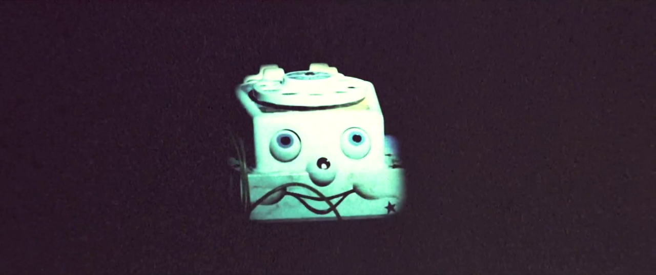 A chatter phone toy illuminated in the darkness