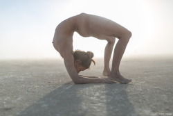 girlsdoingyoga: benhopper: Liz Crosby arching during a dust storm at Burning Man.August 31, 2016. . 