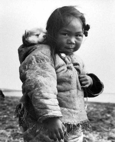ojibwa:ojibwa:every time i remember that photo of the little inuk girl with her puppy i engage in inconsolable hystericsthis is it. this is the photo of all time