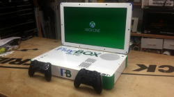 engadget:  This portable laptop mod houses both a PS4 and Xbox One