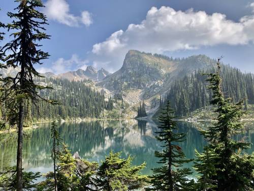 amazinglybeautifulphotography:  We broke free of the smoke just long enough to get this view of Eva Lake outside Revelstoke, BC [OC] [4032x3024] - Author: Waramp on reddit