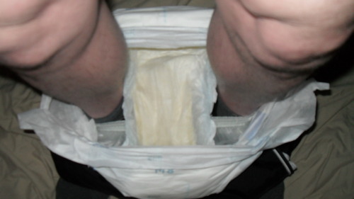 Wet diapers in my plastic pants round my ankles then just plastic pants ready to be pulled up over m