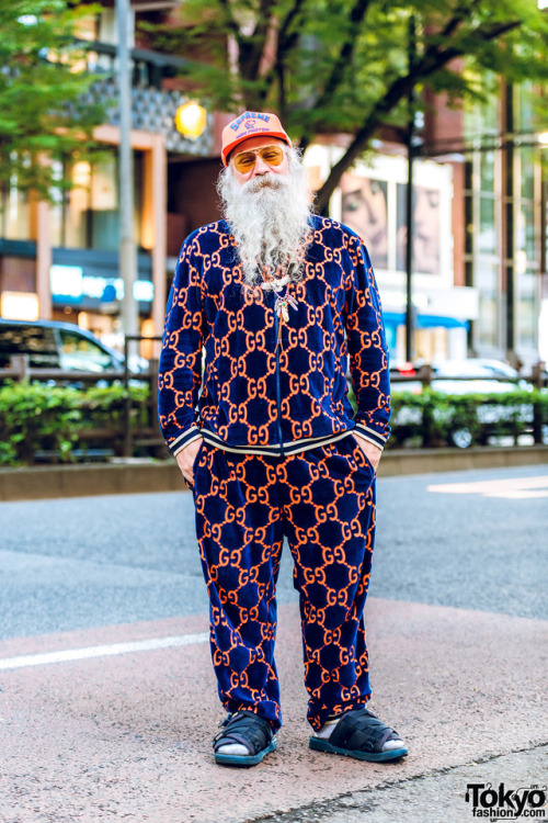 Greg Dacyshyn of Camp High Collective on the street in Harajuku wearing a velour Gucci logo print se
