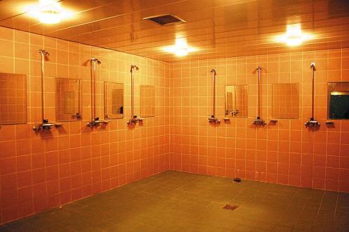 Three men’s shower rooms at Gachon University in Seongnam, South Korea.The top orange shower is in t