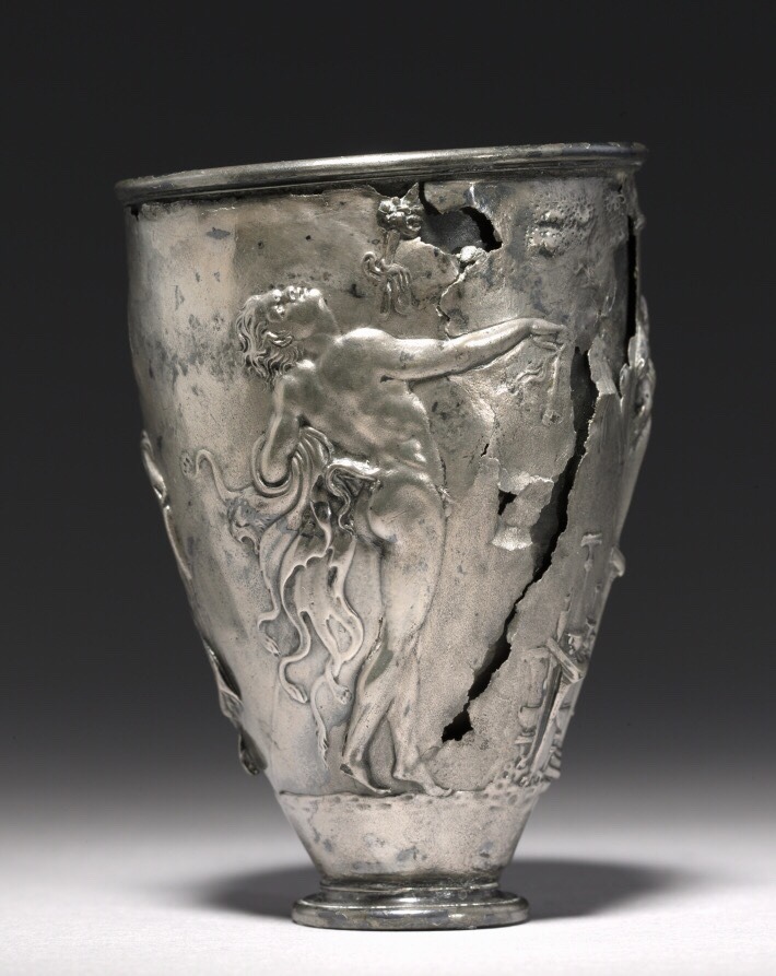 via-appia:  The Vicarello Goblet: woman at the shrine of the god Priapus, maenad