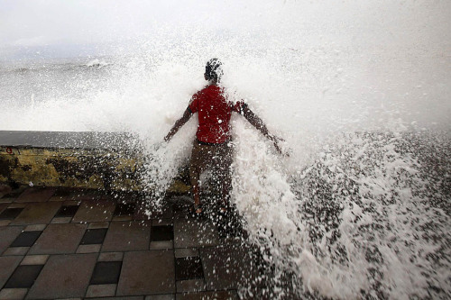 untrustyou:  A large wave drenched a boy during high tide at Mumbai’s seafront. (Danish Siddiqui/Reuters) 