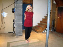 zippo077:  A victim of a particularly sadistic gang of home invaders, Beverly was led down to her basement, bound hand and foot, gagged, and left in this predicament. Forced to stand on her toes to avoid having the noose tighten, she wondered how much