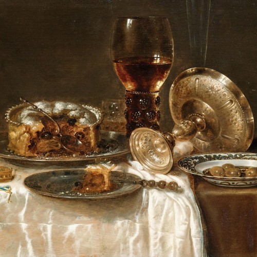 calellon:Olives in a blue and white porcelain bowl, a roemer, wine glasses, an overturned silver taz