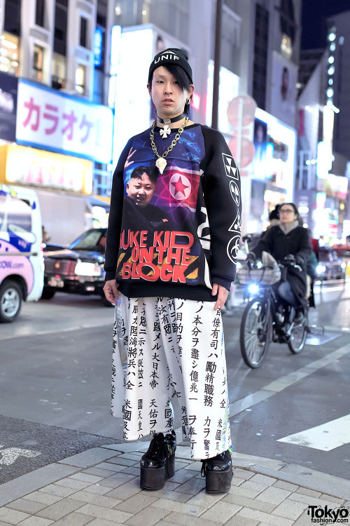 Yana on the street in Harajuku wearing a DAMAGE neoprene top, Buccal Cone kanji print pants, YRU pla