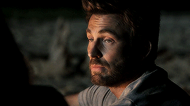The Male Shifts Awkwardly In His Seat, His Steely Gaze Dropping To The Contents Of His Drink Before He