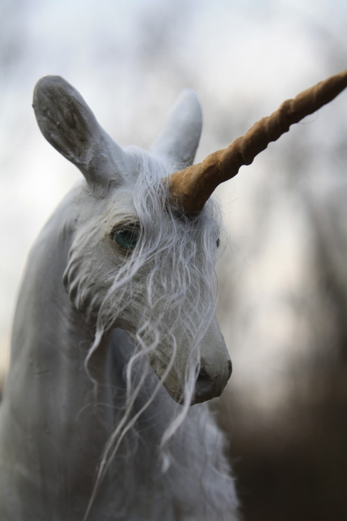 “Demure” is a one of a king unicorn sculpture, made from polymer clay over wire and foil