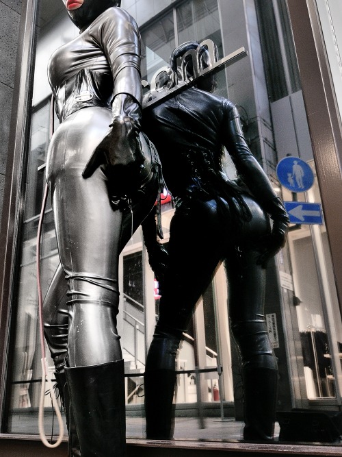 Silver metallic rubber catsuit in public