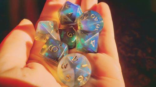 ¬°Crystal Caste Fire Opal Smoke°¬ [Image Description: a dice set sits in the palm of a hand. Rainy d