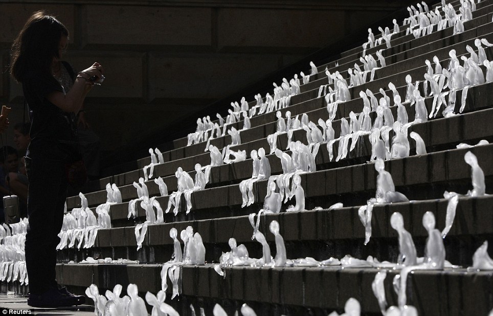 sixpenceee:  A thousand miniature people have slowly melted away in a Berlin square