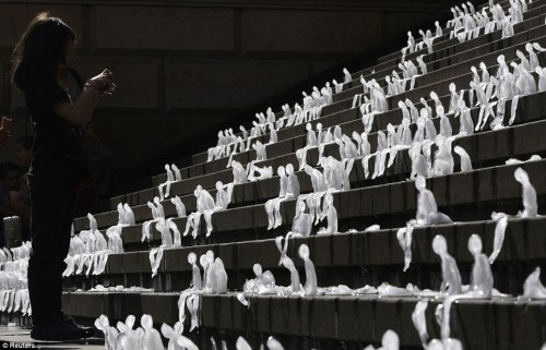 sixpenceee:  A thousand miniature people have slowly melted away in a Berlin square in an effort to draw attention to melting ice caps in Greenland and Antarctica. Brazilian artist Nele Azevedo carved the figures out of ice and placed them on steps in