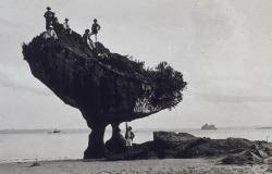  Climbing a mushroom coral rock in the Philippines.