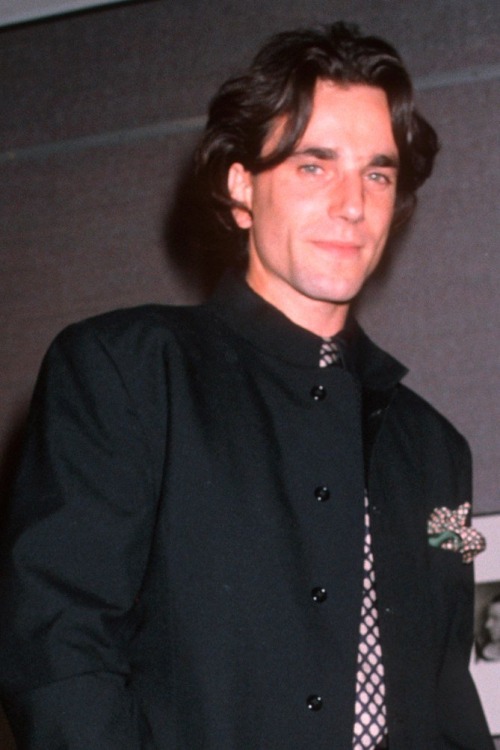 Young Daniel Day Lewis wearing a black coat