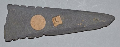 Yup'ikslate harpoon (North America, acquired 1870).Triangularharpoon point with sharpened edges, mad